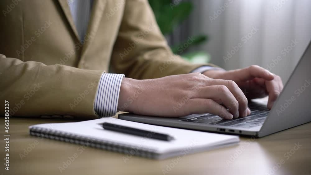Businessman signing documents and check information in the investment plan Businessman signing documents and check information in the investment plan