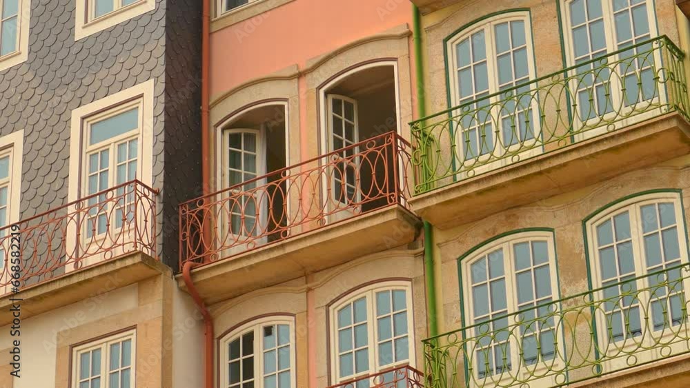Open Doors With Balcony Of Building In Ribeira, Porto, Portugal. - low angle, close up Open Doors With Balcony Of Building In Ribeira, Porto, Portugal. - low angle, close up