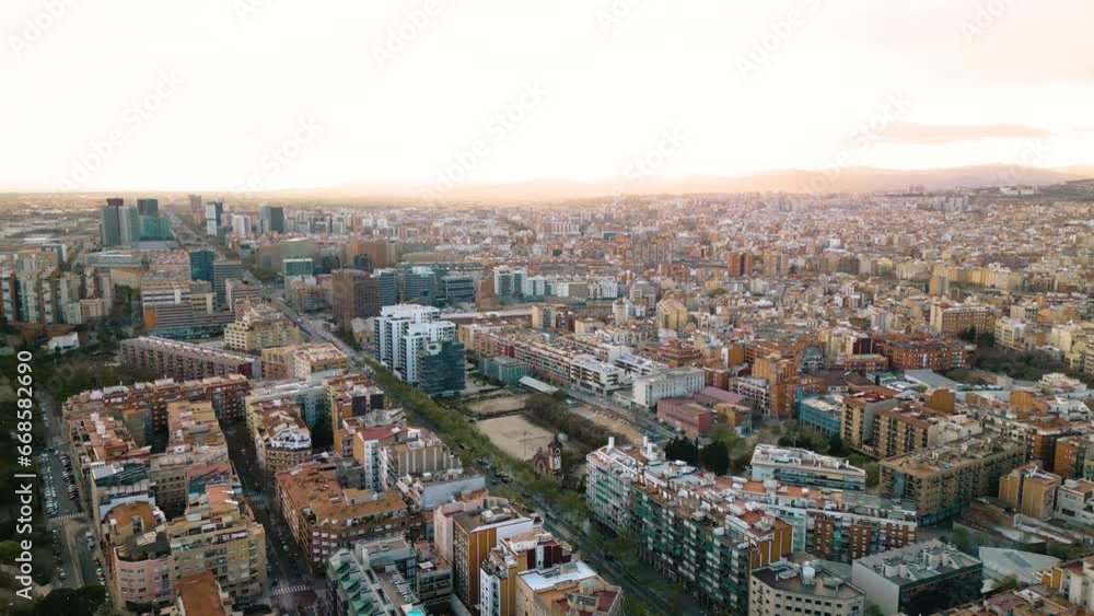 Barcelona at Sunset. Drone Flying Above Urban Cityscape during Golden Hour Barcelona at Sunset. Drone Flying Above Urban Cityscape during Golden Hour