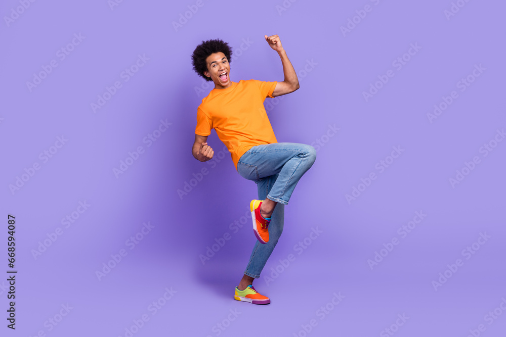 Full size cadre of crazy guy celebrating raise fists up awesome champion approved first job worker isolated on violet color background Full size cadre of crazy guy celebrating raise fists up awesome champion approved first job worker isolated on violet color background