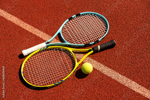 Tennis scene with balls, racquets and hard court surface corner lines © Angelov