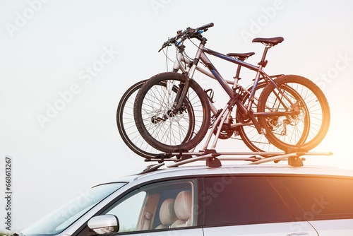 Top roof bicycle mount. Concept of transporting bikes and luggage on the top of the car.