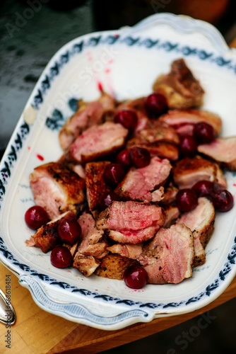 Duck Breast with Cherry Sauce on the outdoor grill.style rustic