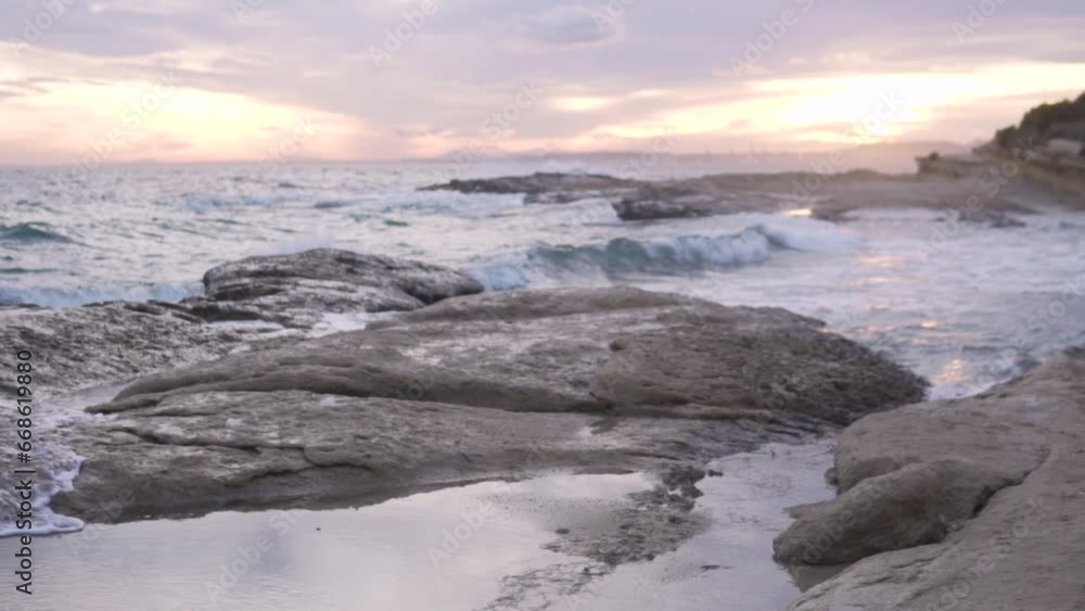 Beautiful rocky beach in the evening at sunset without people Beautiful rocky beach in the evening at sunset without people