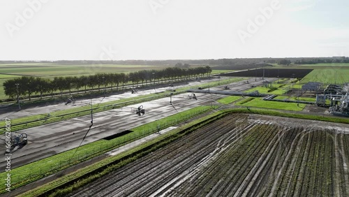 Gas extraction field in the province of Groningen in the Netherlands in the middle of arable land photo