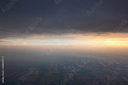 The view from the plane shows the beautiful rice fields below and on the way from Bangkok to Chiang Mai in the evening.