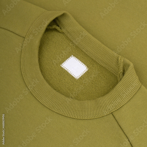 Crew neck of a green sweatshirt clothing tag mockup background