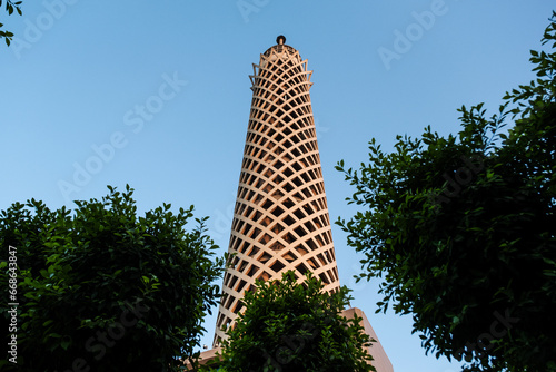 The Cairo tower in Egypt between the trees in the sky