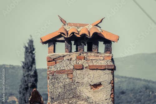 Old mug chimney designed to prevent smoke raids in the village in Sirince izmir turkey photo