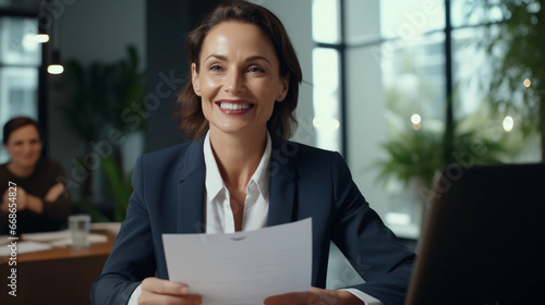 Smiling mature business hr woman holding cv at job interview. Happy mid aged professionall, manager, insurance agent, lawyer consulting clients sitting at work corporate office meeting woman