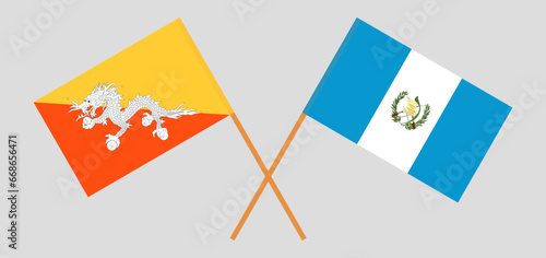 Crossed flags of Bhutan and Guatemala. Official colors. Correct proportion