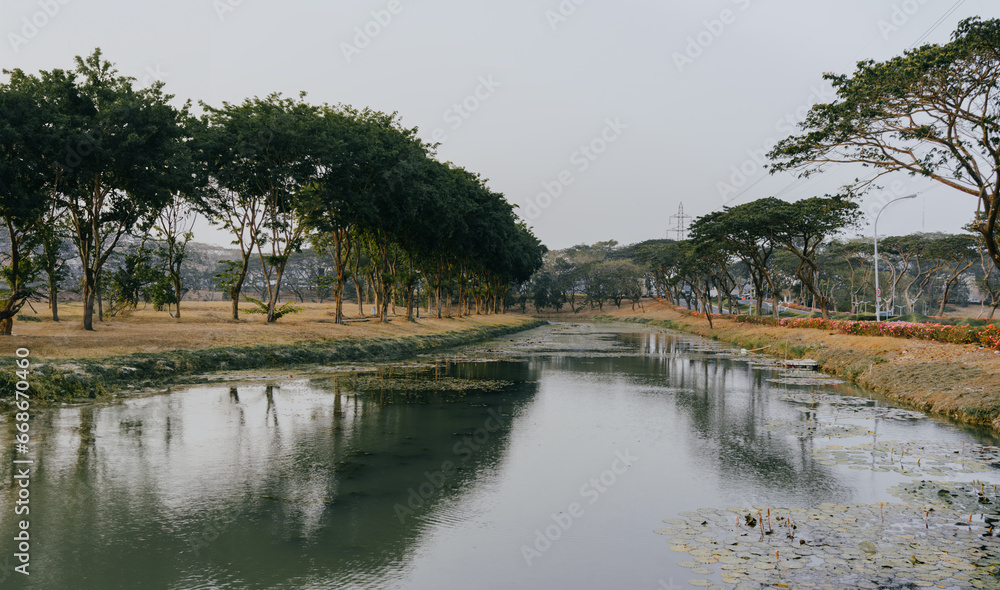 Morning river natural landscape in a luxury residential area. Water reflection. Morning river natural landscape in a luxury residential area. Water reflection.