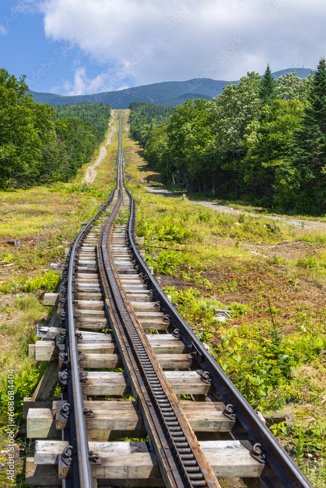 Vertical shot of a long straight part at the beginning of the Mt Washington cog railway track, New Hampshire, USA