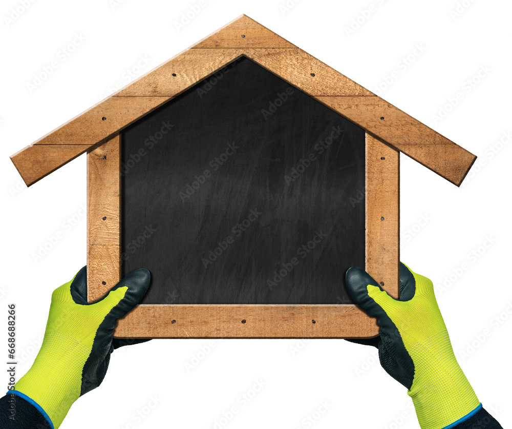 Φωτογραφία Hands with work gloves holding a blank chalkboard in the shape of a wooden house, isolated on white or transparent background with copy space