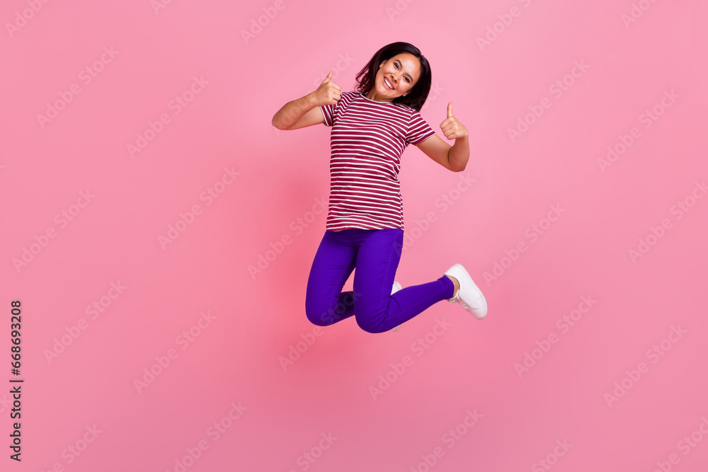 Full size photo of good mood woman with straight hair dressed stylish t-shirt showing thumbs up approve isolated on pink color background