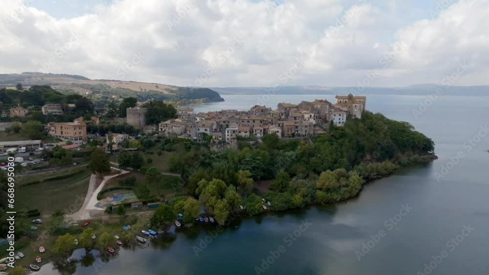 Aerial view of the historic center of Anguillara, in the metropolitan city of Rome, Italy. The town is located on the shores of Lake Bracciano. Aerial view of the historic center of Anguillara, in the metropolitan city of Rome, Italy. The town is located on the shores of Lake Bracciano.