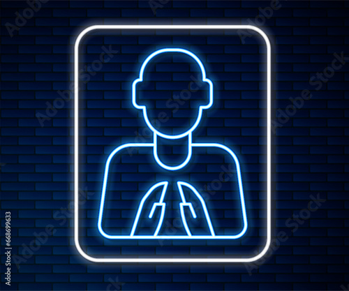 Glowing neon line Hands in praying position icon isolated on brick wall background. Prayer to god with faith and hope. Vector
