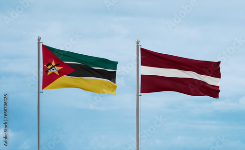 Latvia and Mozambique flags, country relationship concept