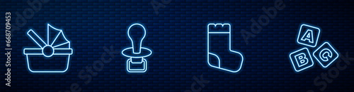 Set line Baby socks, stroller, dummy pacifier and ABC blocks. Glowing neon icon on brick wall. Vector
