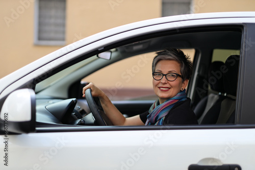 Female driver, happy at the wheel, on a stylish journey in her car © Andrii Zastrozhnov