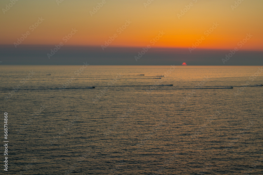 Beautiful sunset near Ajaccio with jet skies on the sea