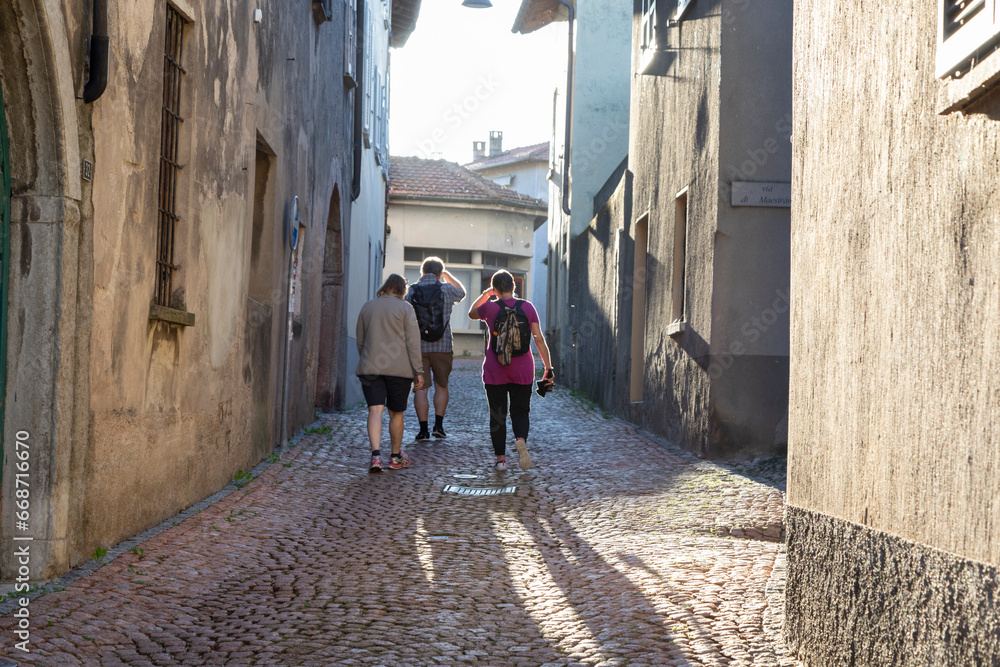People walking in the village of Meride, Ticino, Switzerland