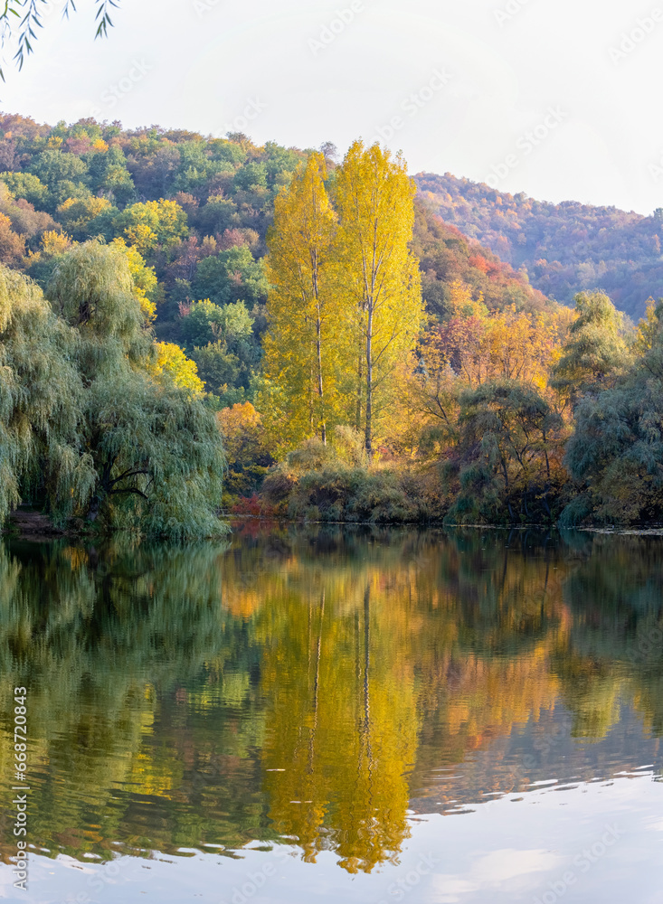 Autumn landscape is not far from the city of Almaty. A magical landscape on a mountain lake. Autumn landscape is not far from the city of Almaty. A magical landscape on a mountain lake.