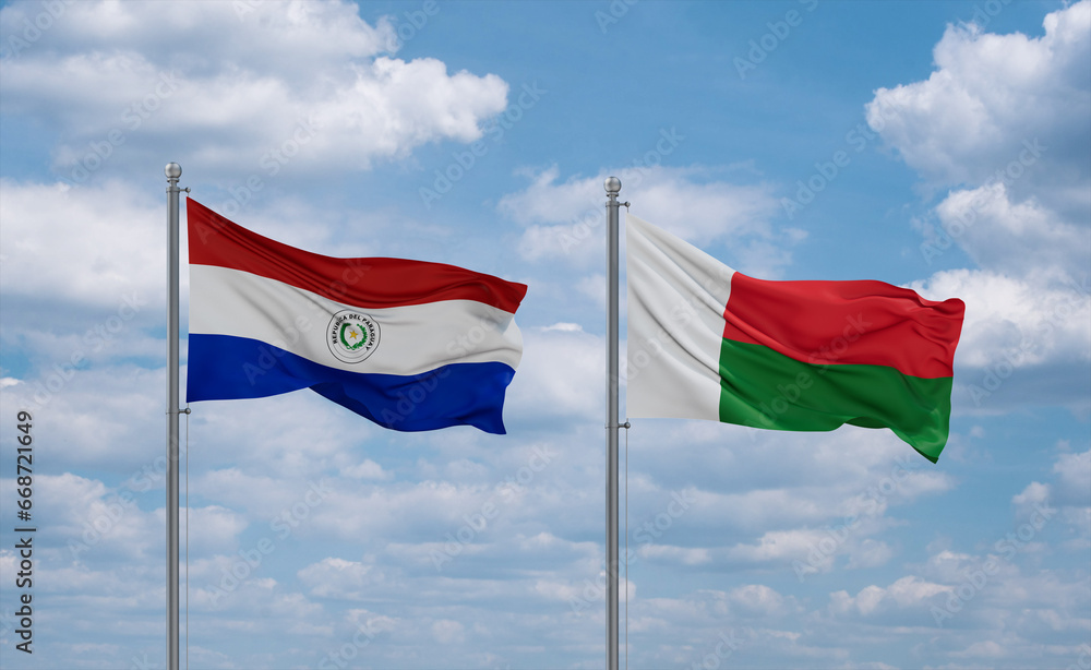 Madagascar and Paraguay flags, country relationship concept Madagascar and Paraguay flags, country relationship concept