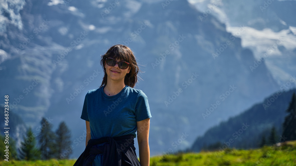 Young woman hiking in the Swiss Alps