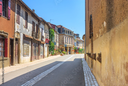 Summer city landscape - view of a medieval street in a provincial French town, in the historical province Gascony, the region of Occitanie of southwestern France