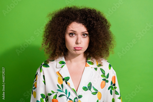 Photo of sad depressed girl dressed print shirt pursing pouting lips having problems isolated green color background