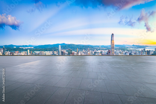 Square floor with city buildings skyline background in Shenzhen © zhao dongfang