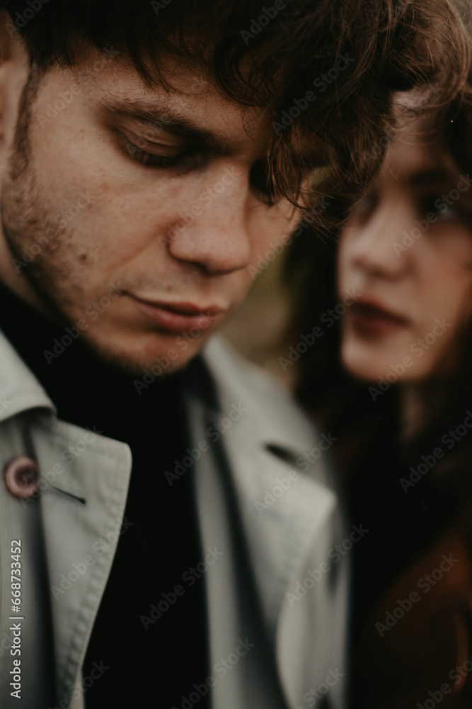 couple in love closeup sensual portrait. Gloomy love scene couple in love closeup sensual portrait. Gloomy love scene