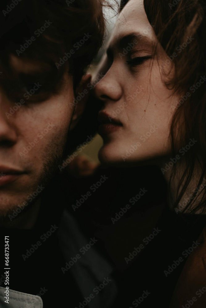 couple in love closeup sensual portrait. Gloomy love scene couple in love closeup sensual portrait. Gloomy love scene