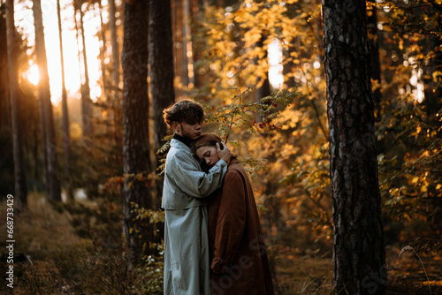 beautiful couple of young people in the forest love each other, valentine's day