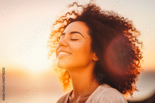Mixed race woman relax and breathing fresh air outdoors. Portrait of young mixed race woman enjoying her life.