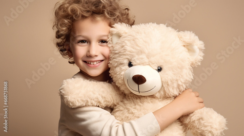 White Boy in casual clothes have fun hold hug teddy bear