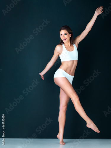 Happy woman, portrait and body in underwear on mockup for diet, weight loss or fitness against a studio background. Attractive female person or model smile in slim, lean figure or health and wellness