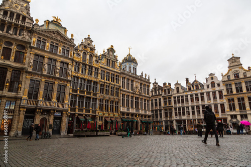 Brussels, Belgium - 22 November 2022: city skyline at famous Grand Place town square, unrecognizable people and tourists at the square