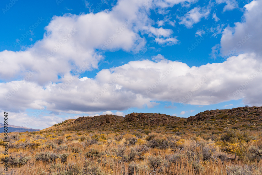 Views while hiking to Crowley Lake. Lots of clouds with a blue sky and autumn leaf colors. Views while hiking to Crowley Lake. Lots of clouds with a blue sky and autumn leaf colors.