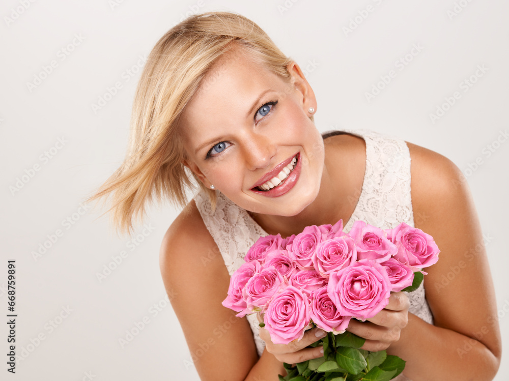 Flowers, wedding and smile with woman in studio for floral, valentines day and romance. Bouquet, gift and happy with female person and pink roses on white background for elegant, love and present Flowers, wedding and smile with woman in studio for floral, valentines day and romance. Bouquet, gift and happy with female person and pink roses on white background for elegant, love and present