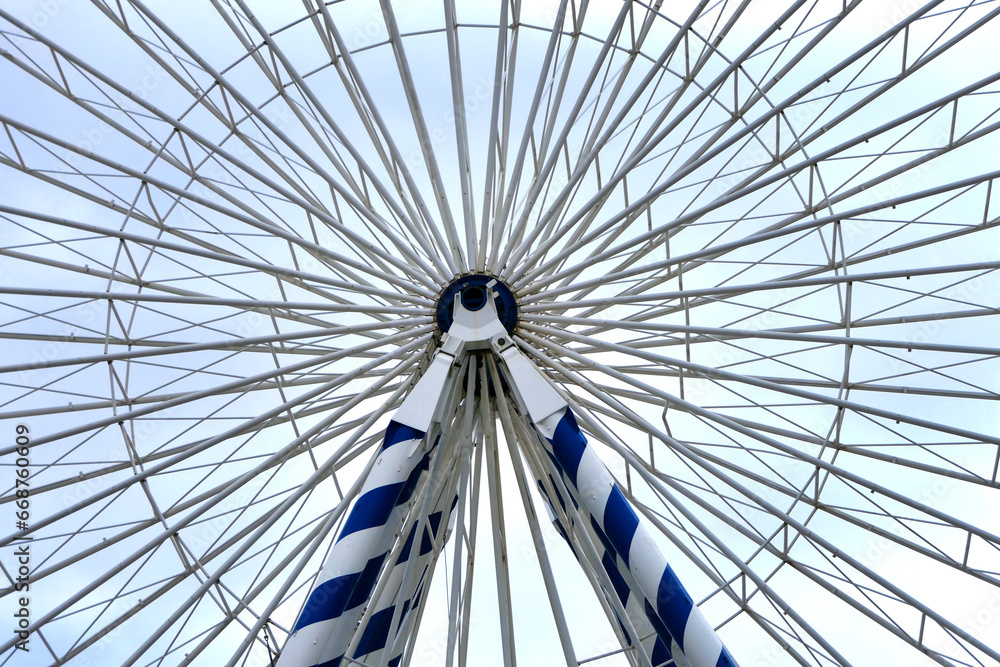 View of the intricate supporting structure radiating from the central hub of the Giant Ferris Wheel ride on Pierre Lataillade Pier in the seaside resort of Arcachon, France
View of the intricate supporting structure radiating from the central hub of the Giant Ferris Wheel ride on Pierre Lataillade Pier in the seaside resort of Arcachon, France