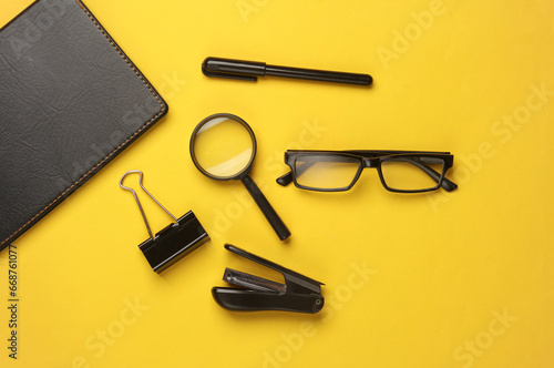 Set of office stationery on yellow background. Flat lay