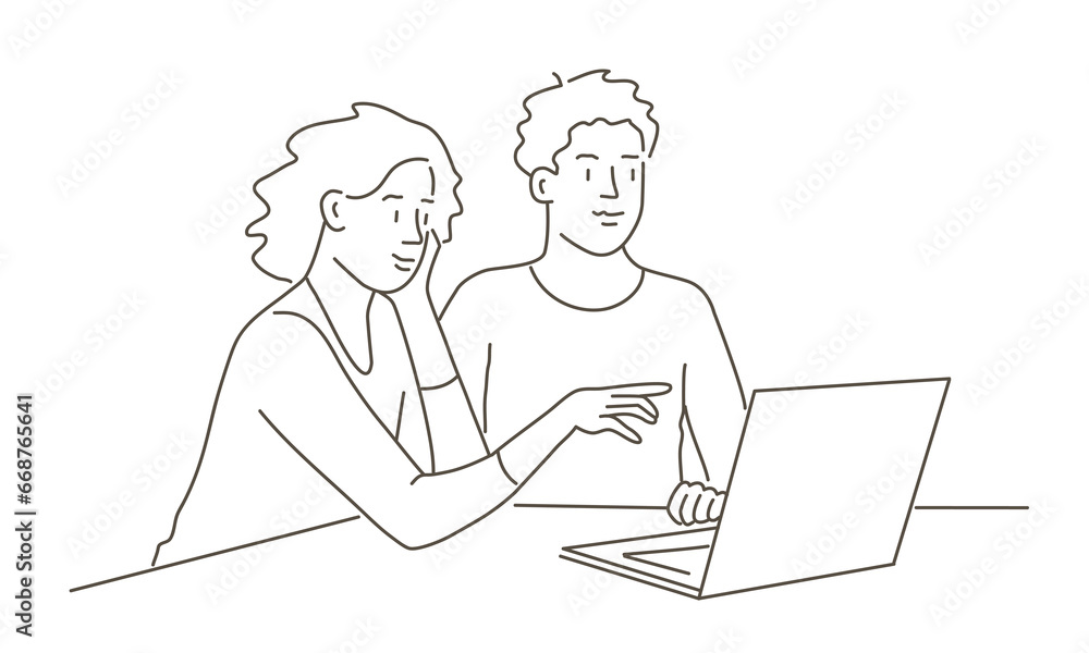 Couple working at laptop together. Couple working at laptop together.