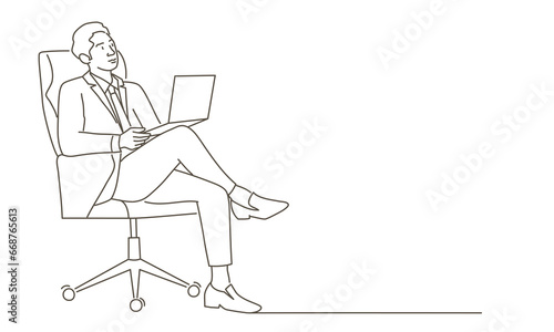 Man is using a laptop while sitting in his desk chair.