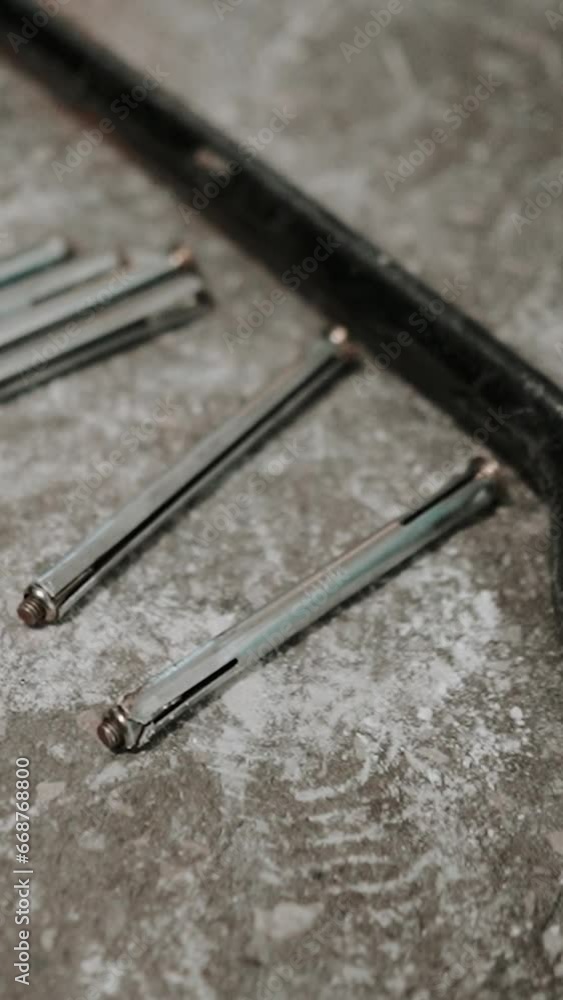 a master installs doors to an apartment in a house, crowbar and other iron craftsman tools for installing door hardware a master installs doors to an apartment in a house, crowbar and other iron craftsman tools for installing door hardware
