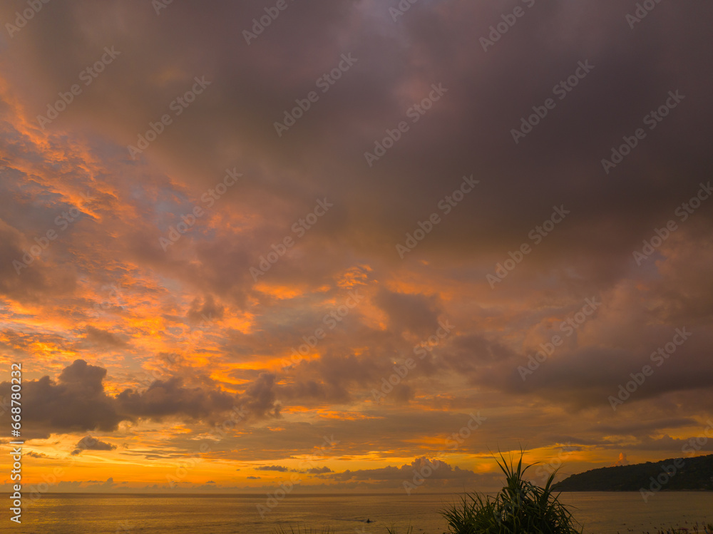 .aerial view amazing sky in sunset above the ocean at Karon beach Phuket..Imagine a fantasy bright yellow clouds changing in colorful sky..Gradient color. Sky texture, abstract nature background.