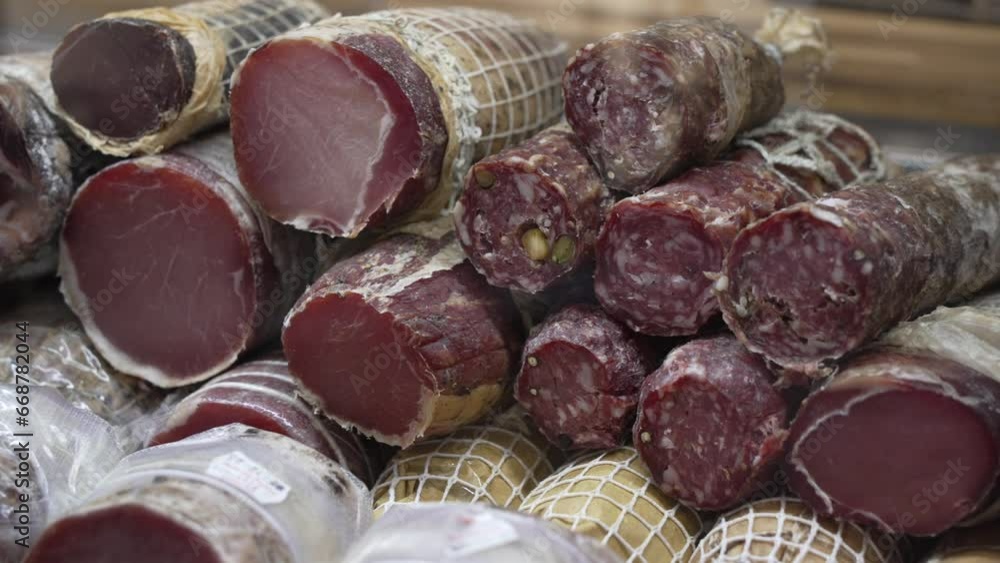 View of various hams, meats and cheeses in shop in San Gimignano, San Gimignano, Province of Siena, Tuscany, Italy
