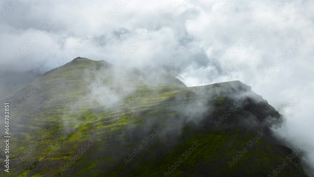 Flying Through Clouds Above Green Hills, Paradise Heaven Mountain Range with High Peaks, Wonderful Inspiring Natural in Iceland Flying Through Clouds Above Green Hills, Paradise Heaven Mountain Range with High Peaks, Wonderful Inspiring Natural in Iceland