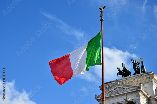 The Italian flag flutters in the wind with its three colors: green, white and red